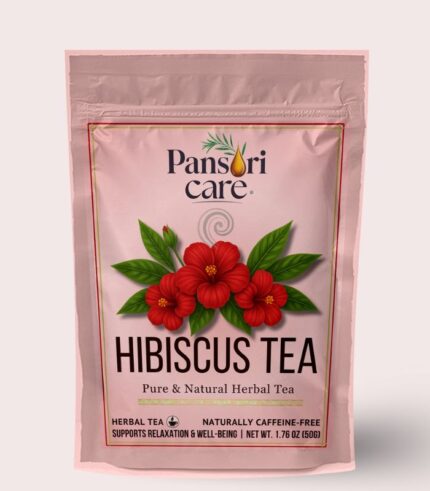 Pansari Care Hibiscus Tea in a glass cup, surrounded by dried hibiscus flowers and a lemon slice.