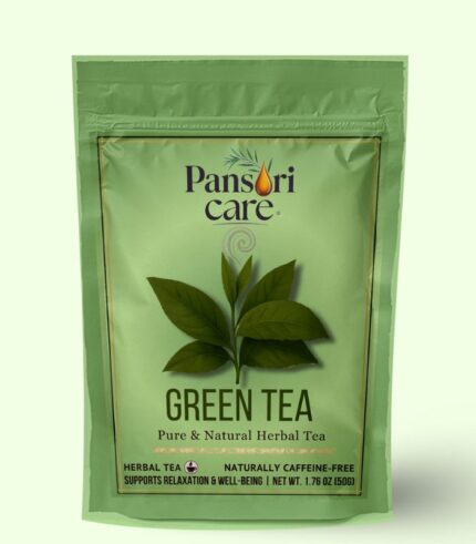Pansari Care Green Tea in a glass teacup, with dried green tea leaves and a teapot.