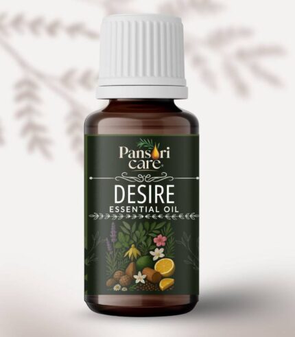 A bottle of Pansari Care Desire Essential Oil blend with dried flowers and a sparkling bottle.