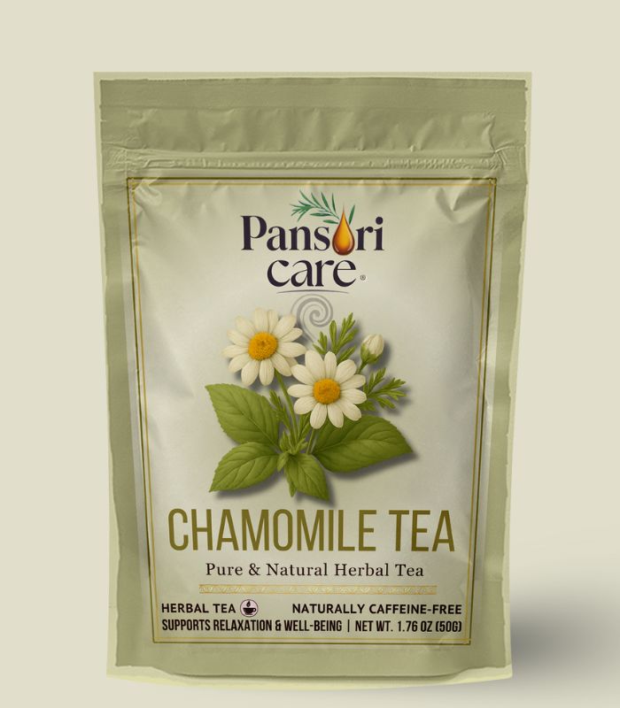 14 Pansari Care Chamomile Tea in a clear glass teacup, with dried chamomile flowers and a fresh chamomile sprig.