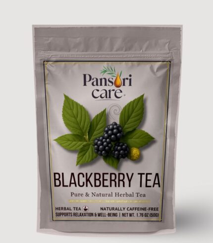 Pansari Care Blackberry Tea in a clear glass teacup, with dried blackberry leaves and fresh blackberries.