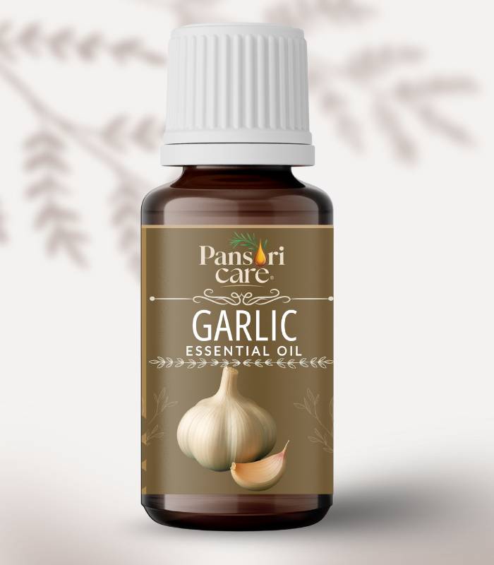 17 Pansari Care Garlic Essential Oil bottle with fresh garlic bulbs and cloves.