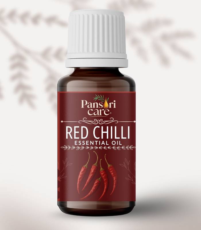 28 Pansari Care Red Chilli Essential Oil bottle with fresh red chilli peppers