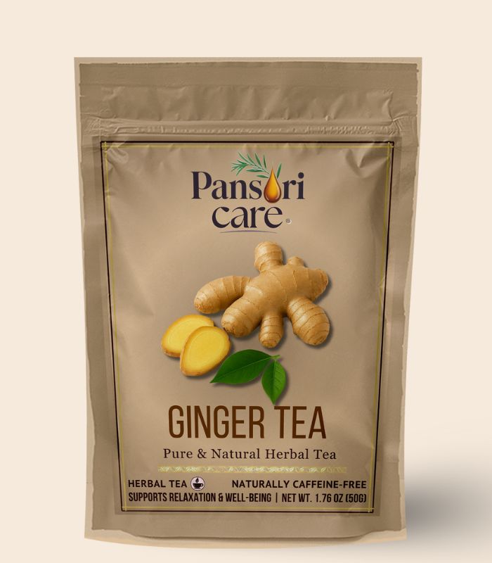 8 Pansari Care Ginger Tea in a clear glass mug, with sliced ginger root and lemon.