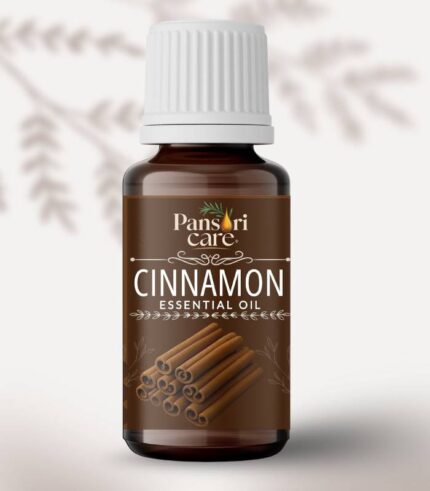 Pansari Care Cinnamon Essential Oil bottle with cinnamon sticks and powder.
