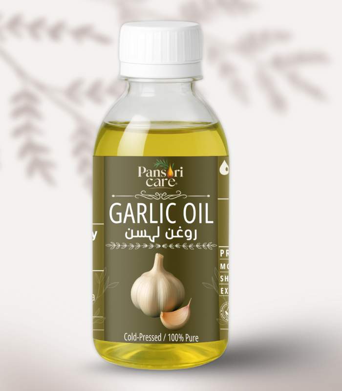 garlic Pansari Care Garlic Oil bottle with fresh garlic cloves and crushed garlic.