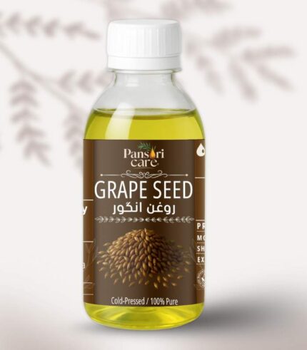 Pansari Care Grape Seed Oil bottle with fresh grapes and grape seeds.