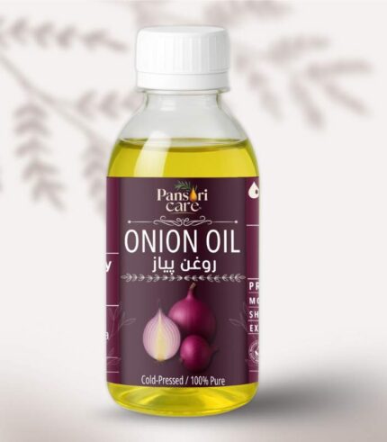 Pansari Care Onion Oil bottle with a few whole red onions and sliced onions.