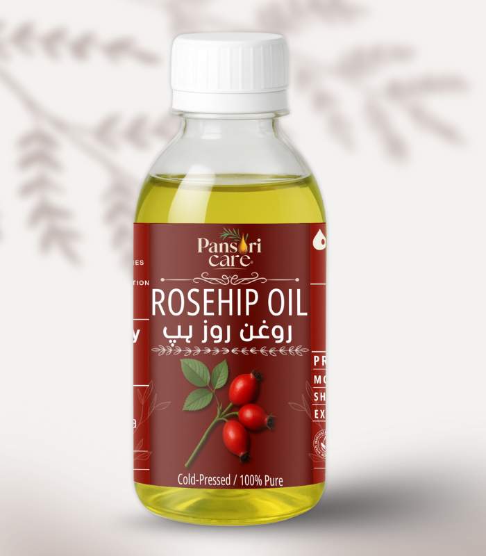 rosehip Pansari Care Rosehip Oil bottle with fresh rosehips and rosehip seeds.