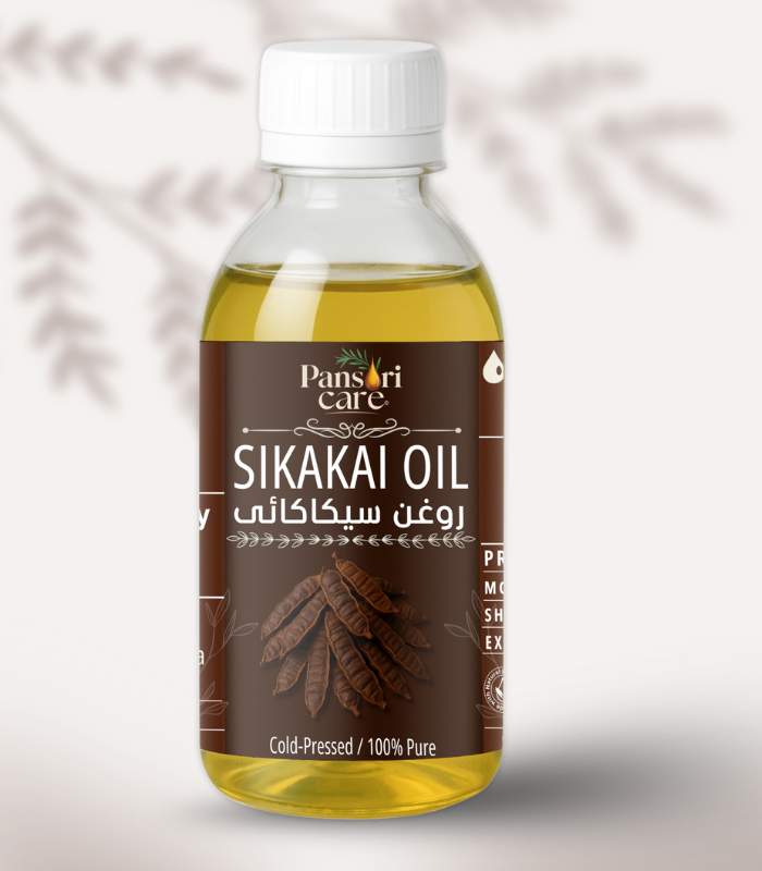 sikakai Pansari Care Shikakai Oil bottle with fresh shikakai pods and powder.