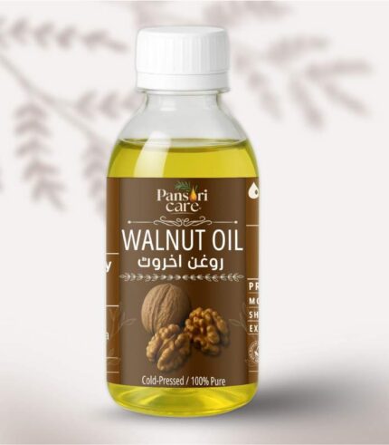 Pansari Care Walnut Oil bottle with fresh walnuts in their shells and shelled walnuts.